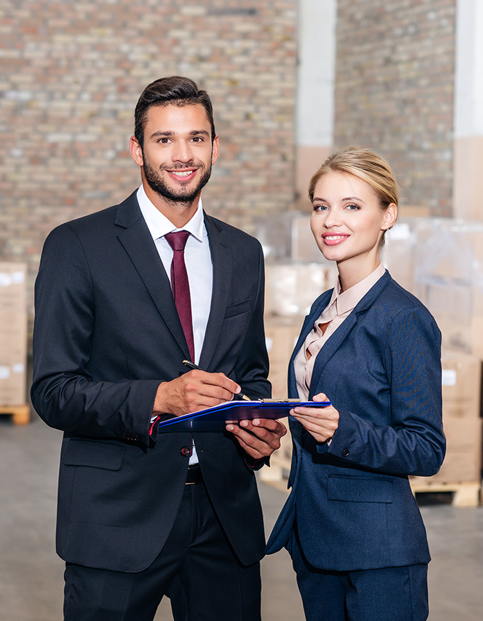 happy business colleagues signing contract at ware K8JLN2T